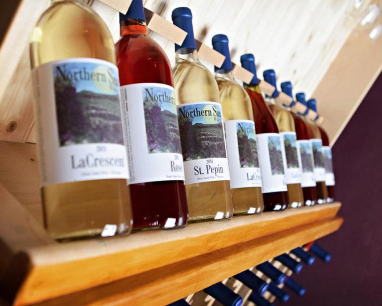 row of wine bottles on display