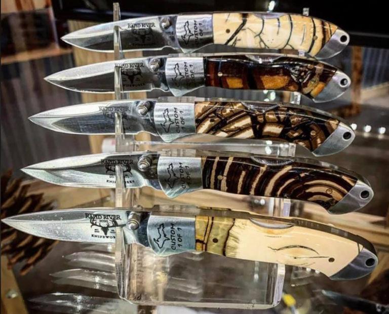 display of hand-crafted rapid river knives