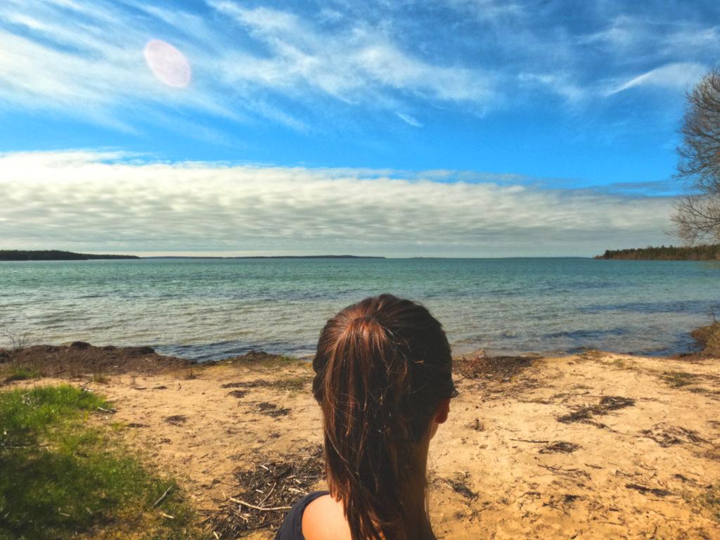 head of a woman overlooking sac bay